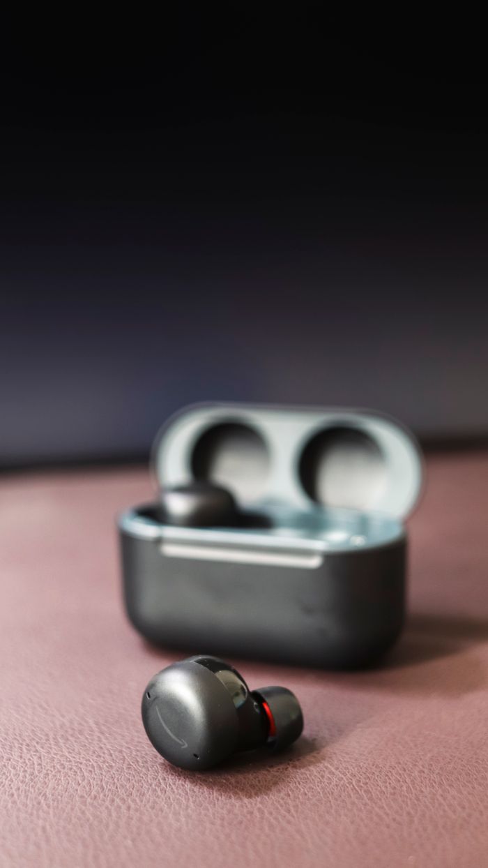 services-img High-quality wireless earbuds with charging case on a stylish backdrop, highlighting their modern design.
